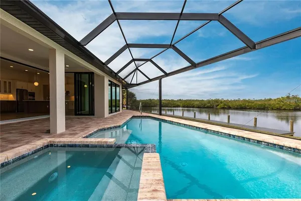 a view of a swimming pool with a lake view