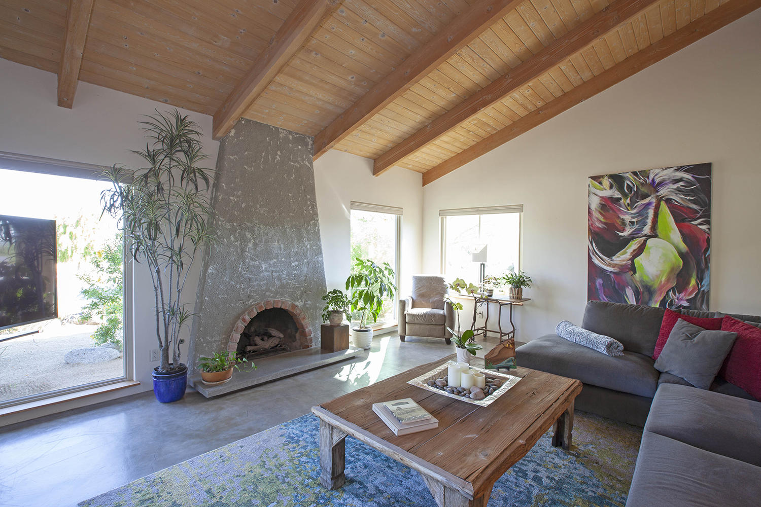 72861 Haystack Road Palm Desert, CA 92260 - Photo 15 of 45 a living room with furniture and a fireplace