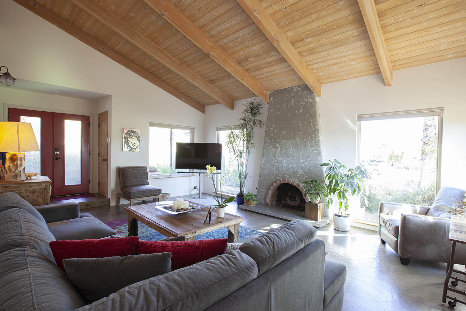 72861 Haystack Road Palm Desert, CA 92260 - Photo 16 of 45 a living room with furniture flat screen tv and a fireplace
