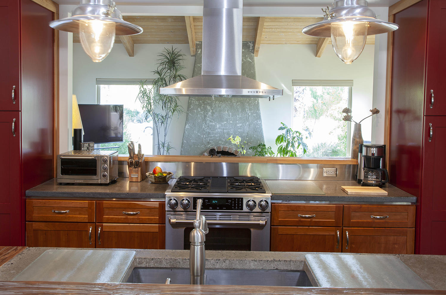 72861 Haystack Road Palm Desert, CA 92260 - Photo 19 of 45 a kitchen with stainless steel appliances granite countertop a stove a sink and a refrigerator