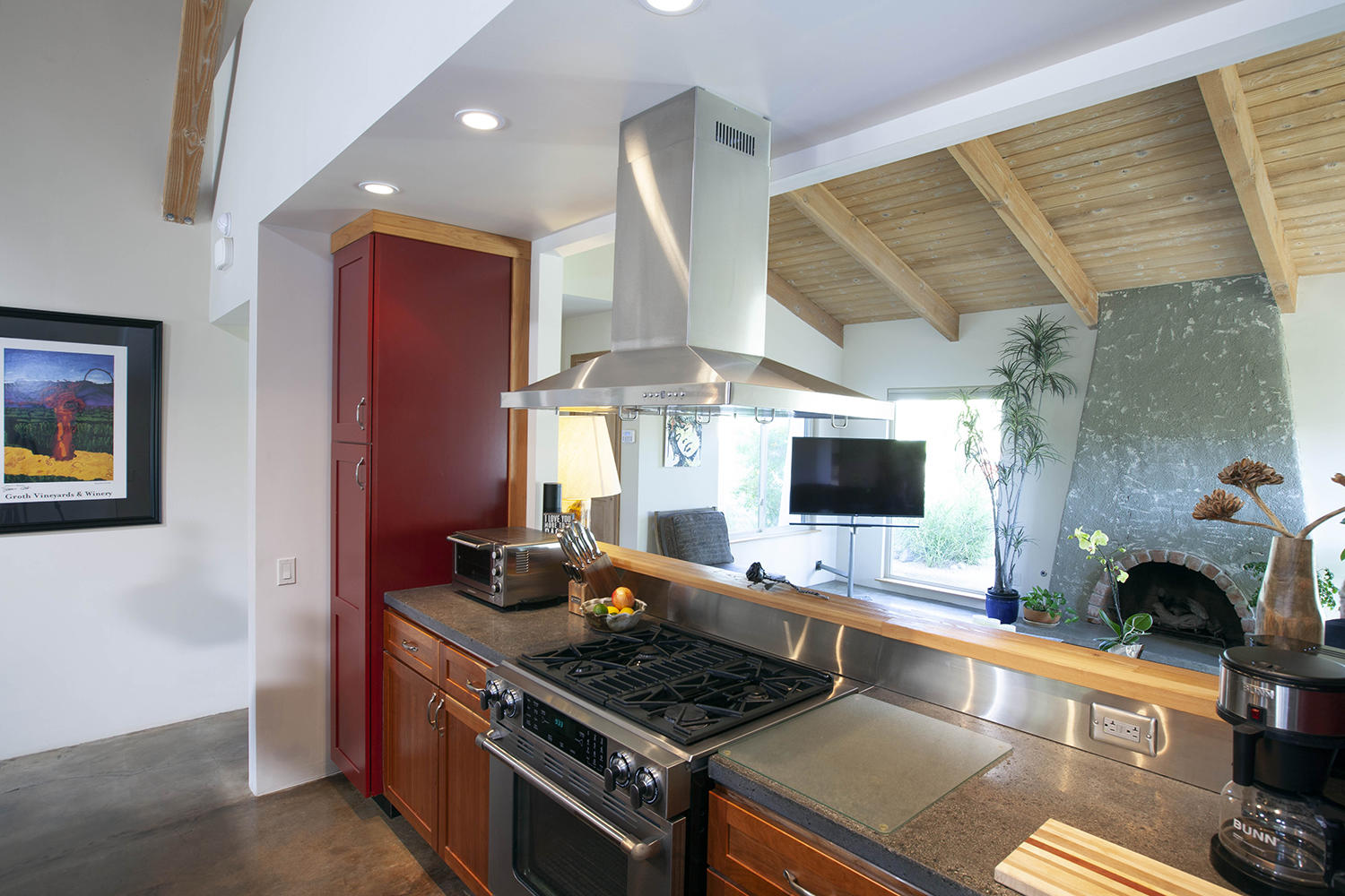 72861 Haystack Road Palm Desert, CA 92260 - Photo 25 of 45 a kitchen with stainless steel appliances granite countertop a stove and a view of living room