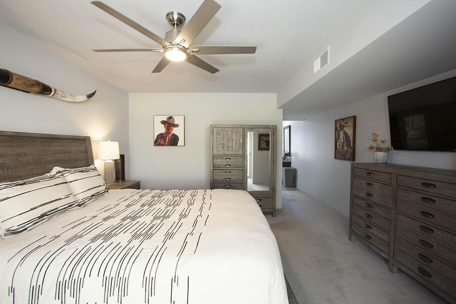 72861 Haystack Road Palm Desert, CA 92260 - Photo 29 of 45 a bedroom with a bed a window and a television