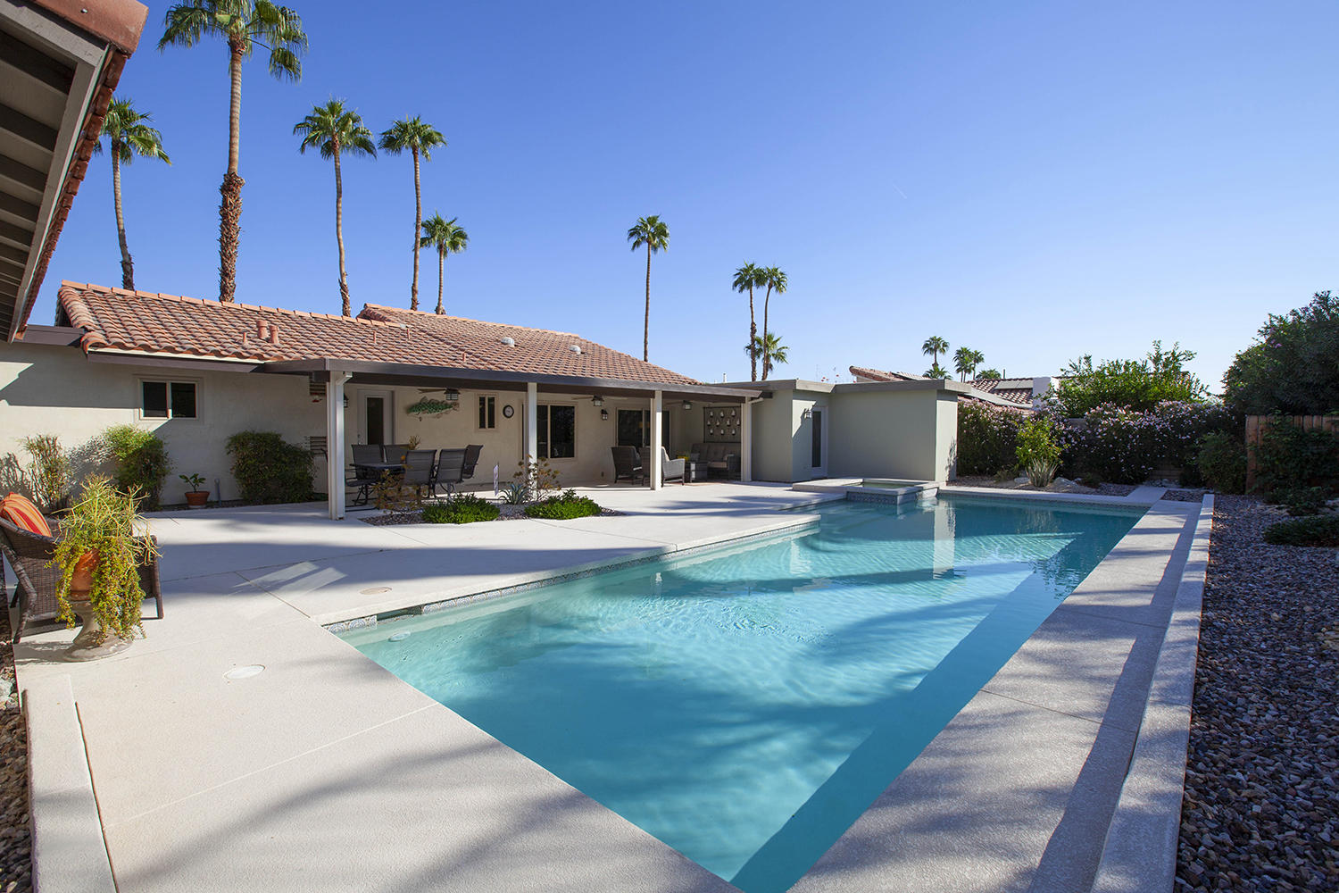 72861 Haystack Road Palm Desert, CA 92260 - Photo 3 of 45 a view of a house with a swimming pool