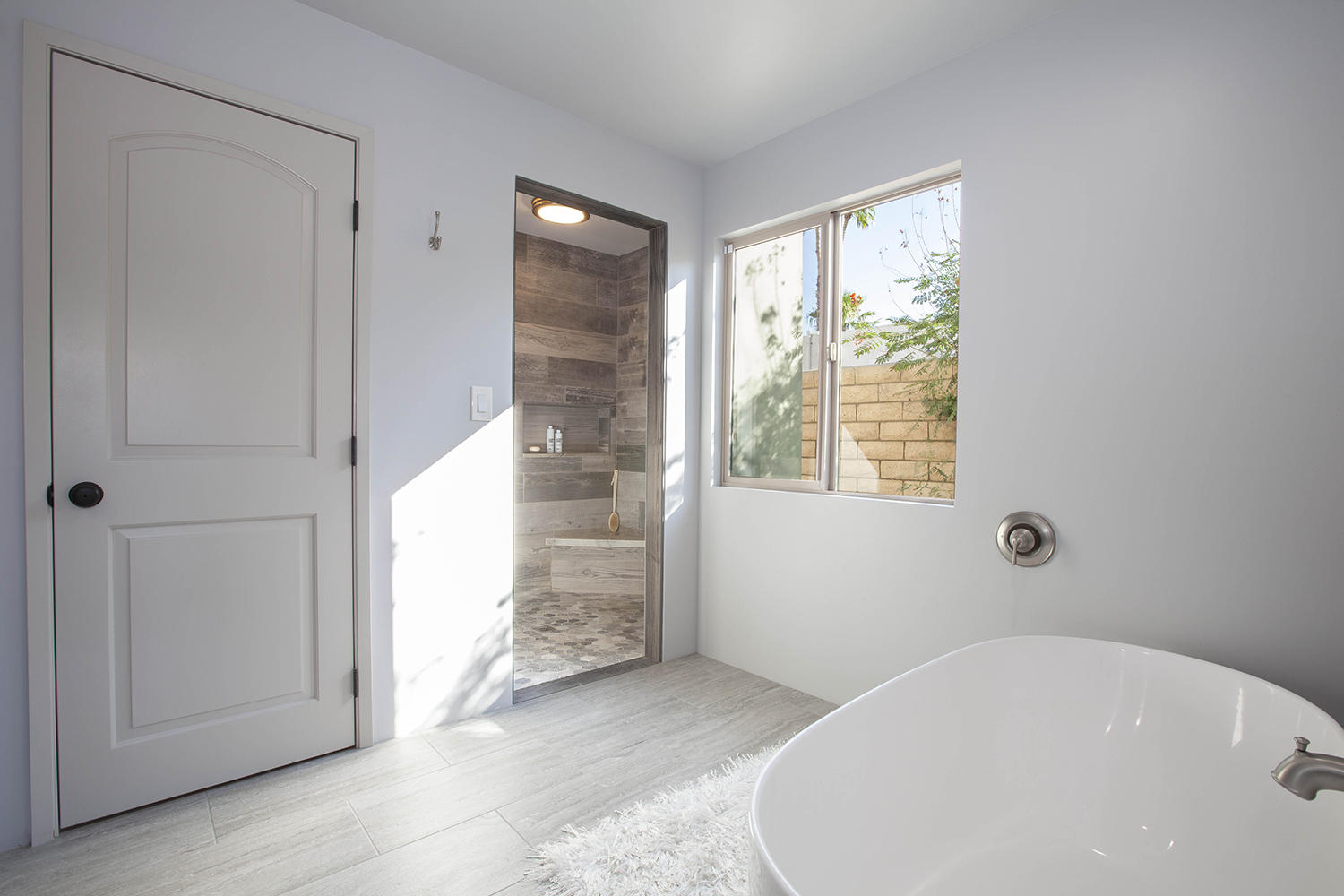 72861 Haystack Road Palm Desert, CA 92260 - Photo 31 of 45 a bathroom with a bathtub and a shower