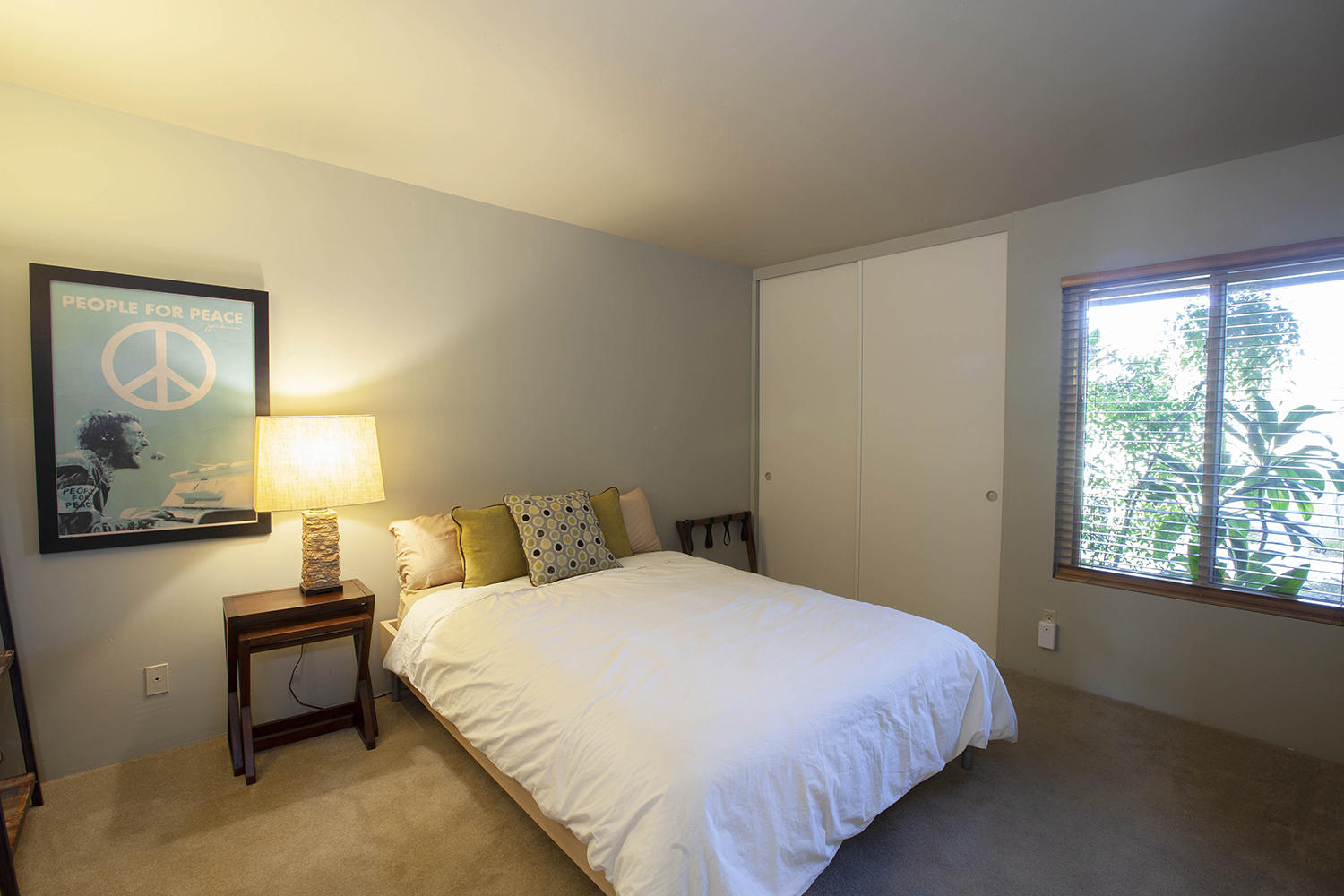 72861 Haystack Road Palm Desert, CA 92260 - Photo 33 of 45 a bedroom with a bed and lamp next to a window