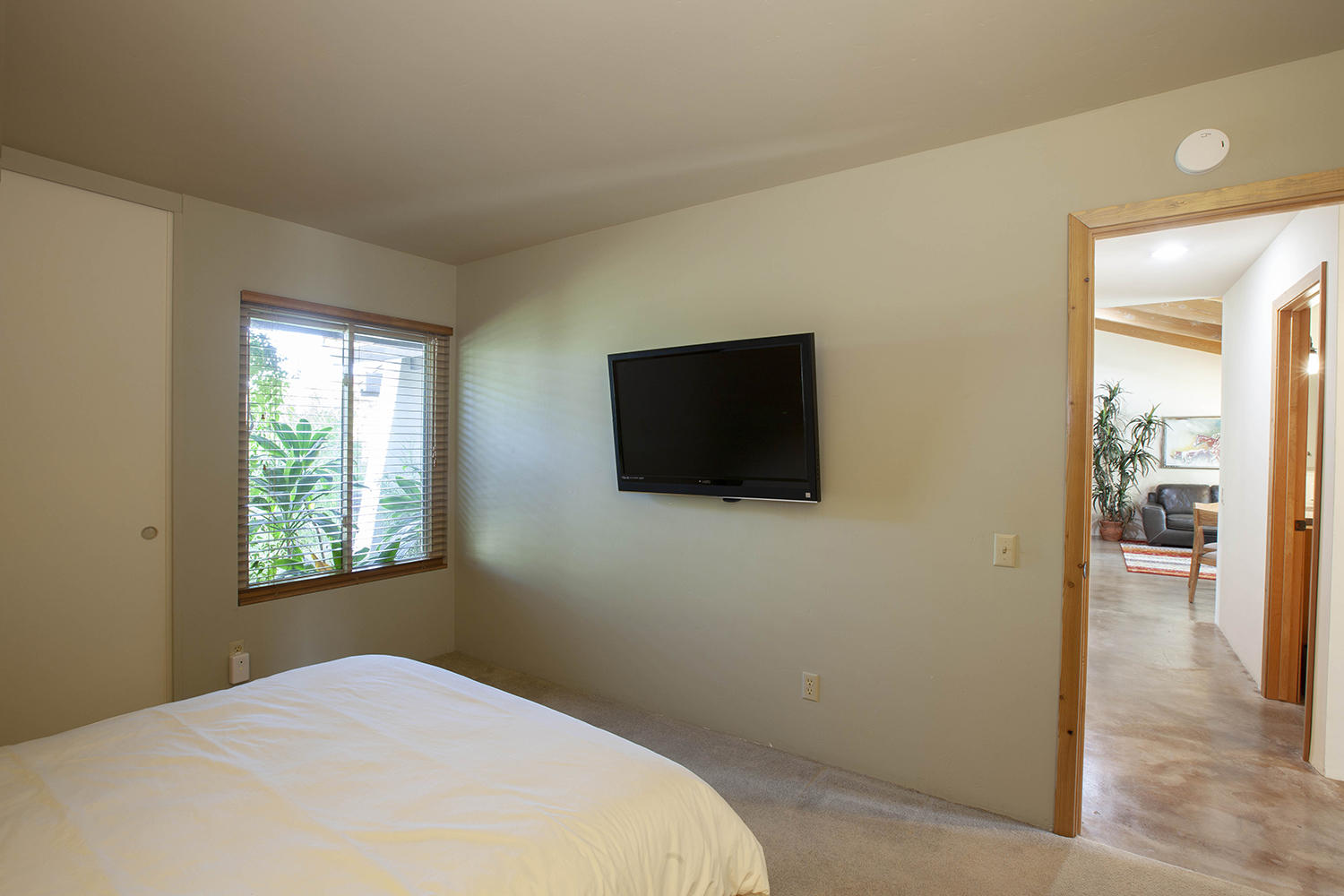 72861 Haystack Road Palm Desert, CA 92260 - Photo 34 of 45 a bedroom with a bed and a flat screen tv
