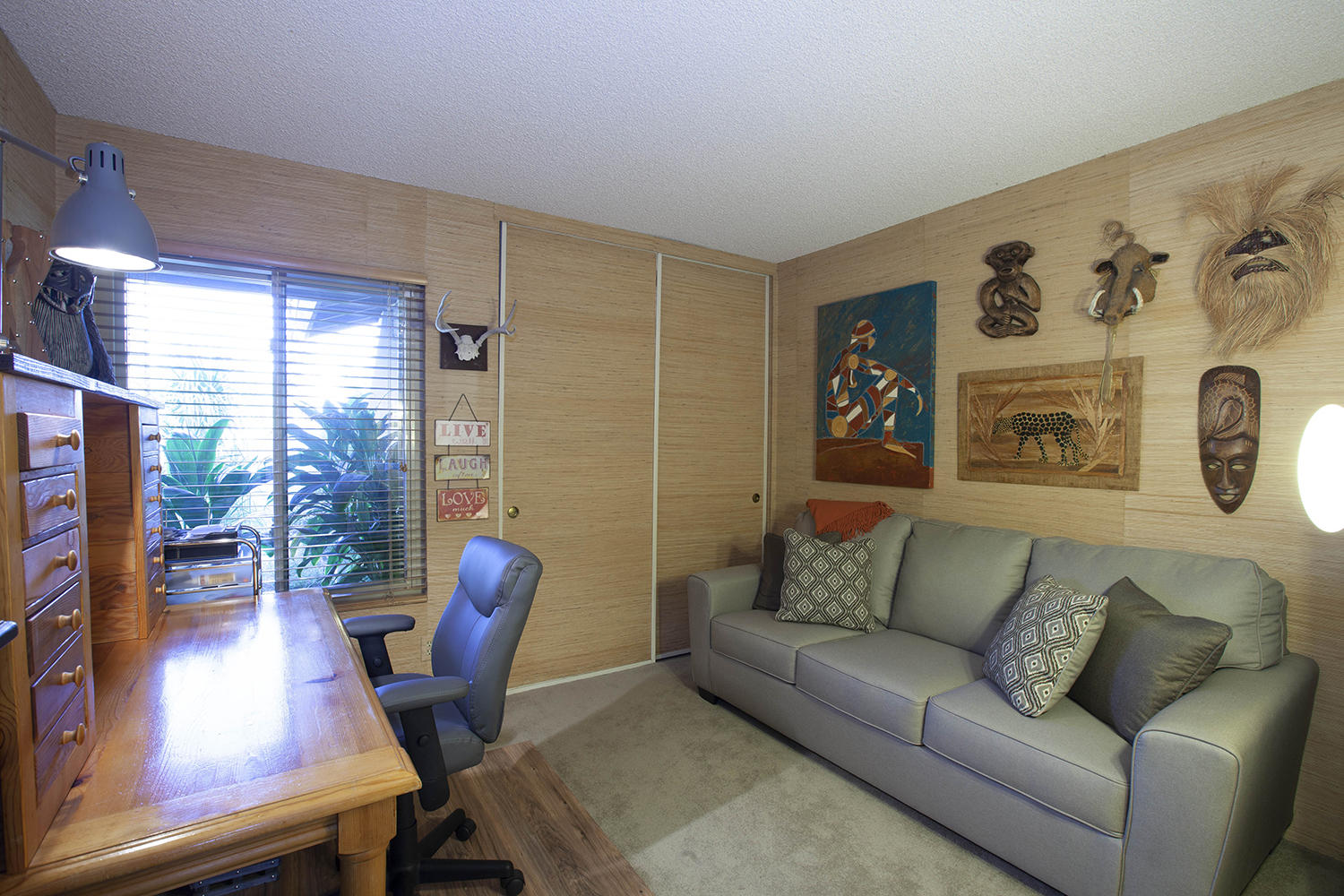 72861 Haystack Road Palm Desert, CA 92260 - Photo 37 of 45 a living room with furniture and a large window