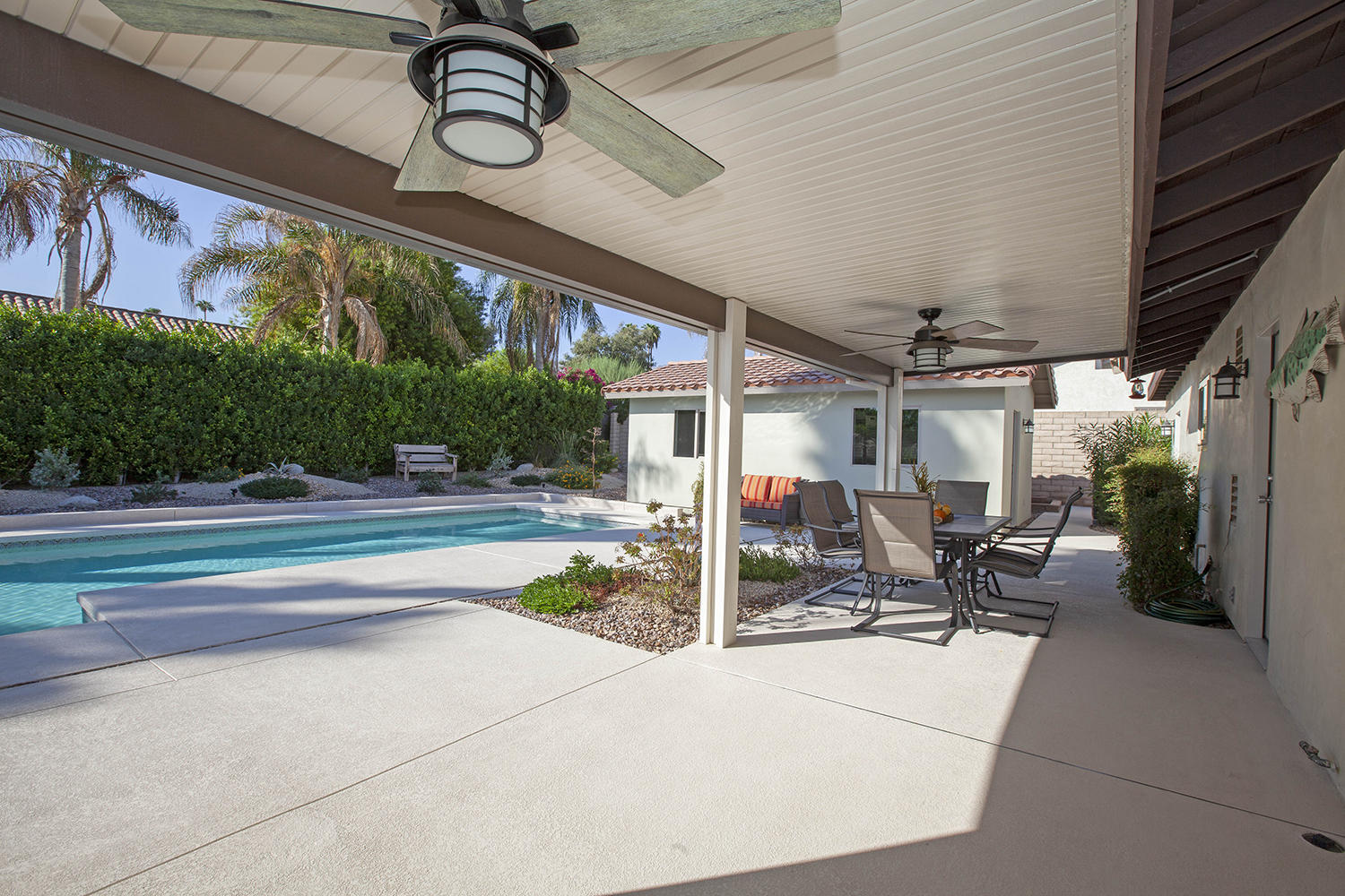 72861 Haystack Road Palm Desert, CA 92260 - Photo 39 of 45 a view of swimming pool with sitting area