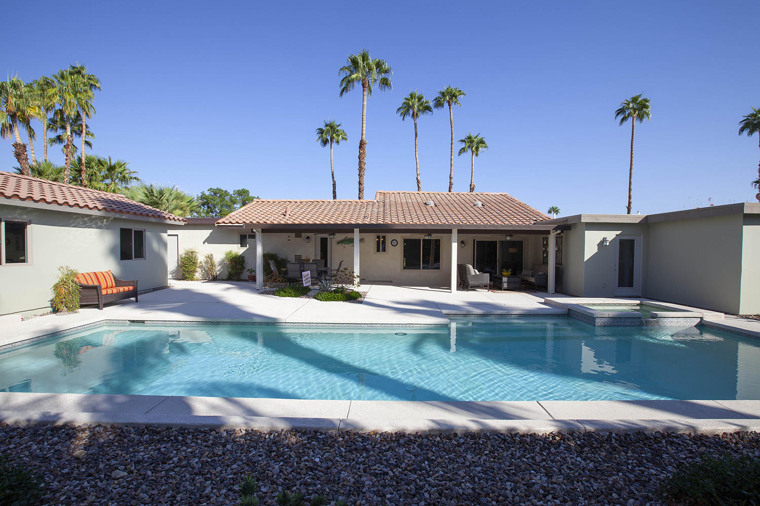 72861 Haystack Road Palm Desert, CA 92260 - Photo 45 of 45 a front view of a house with swimming pool having outdoor seating
