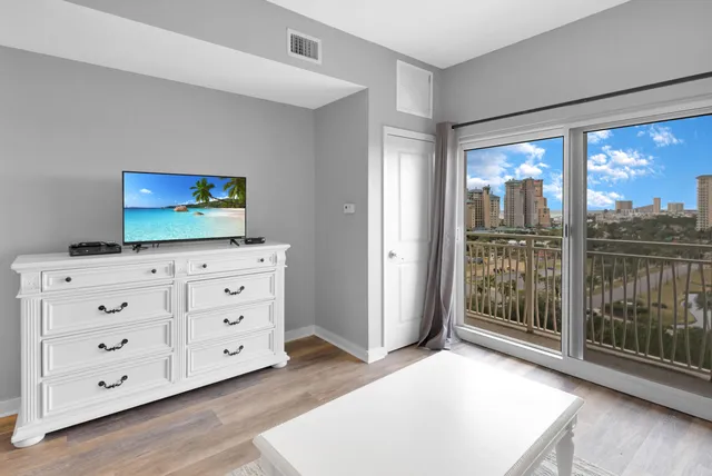 a living room with furniture and large window