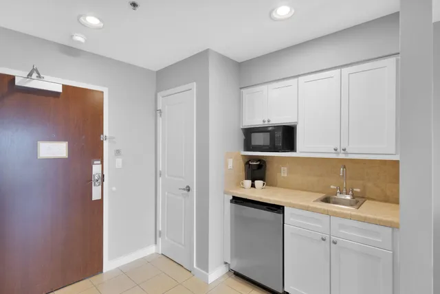 a kitchen with cabinets and a sink