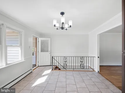 a bathroom with a granite countertop sink a toilet a mirror a vanity and bathtub