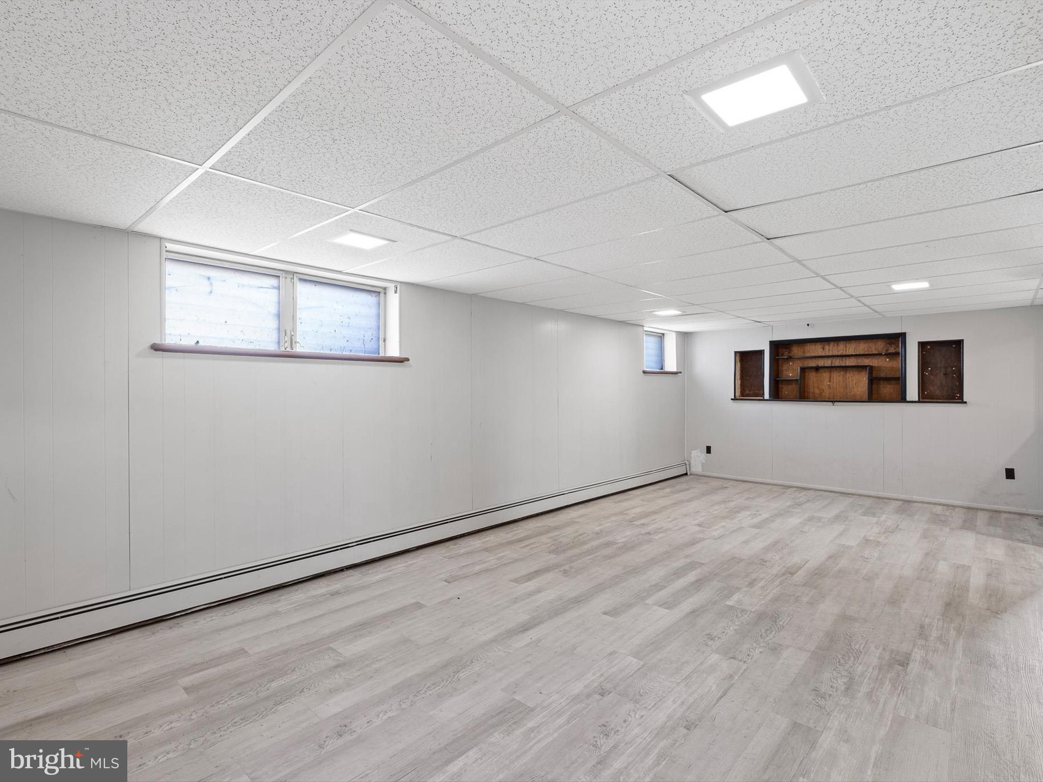 1802 Hettering Road Wilmington, DE 19810 - Photo 17 of 29 a view of a big room with wooden floor and windows