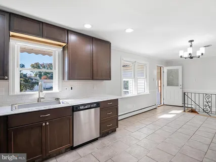 a spacious bathroom with a double vanity sink and a mirror