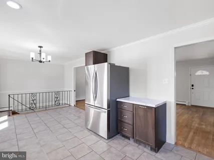 a kitchen with cabinets and stainless steel appliances