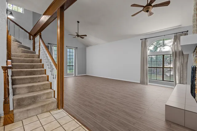 a view of an entryway with wooden floor and a living room