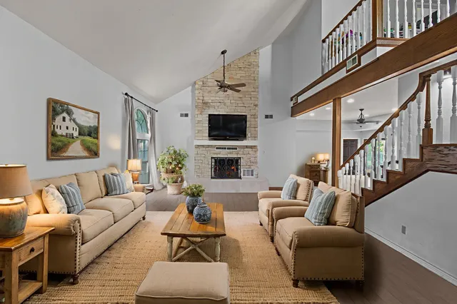 a living room with furniture fireplace and a flat screen tv