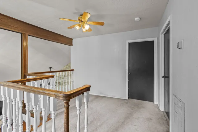 a house with a trees in front of it