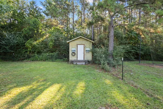 a view of a house with a big yard
