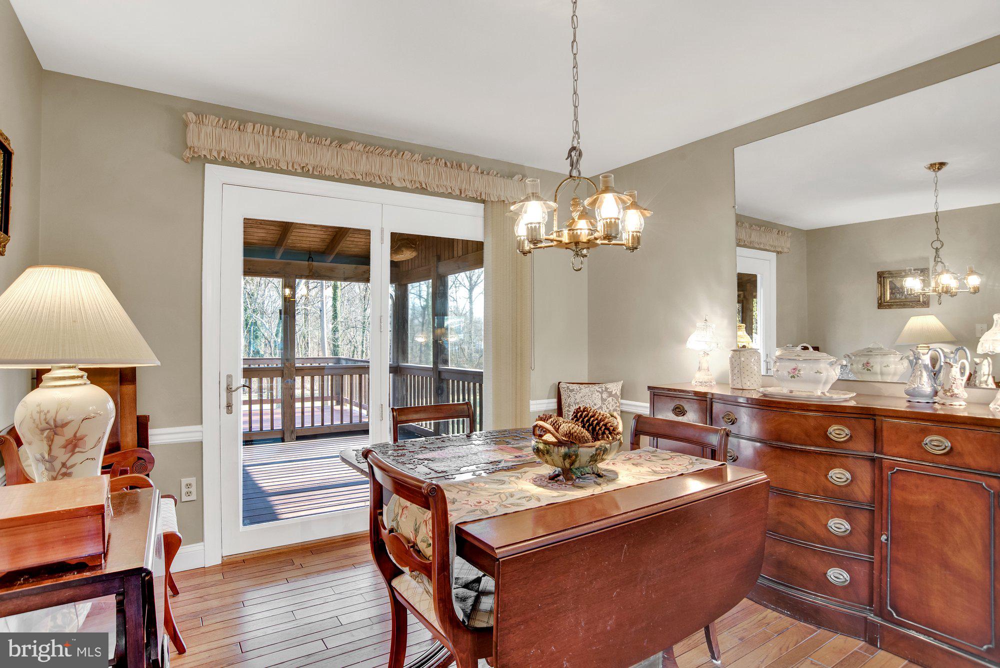 219 Ridgeway Road Catonsville, MD 21228 - Photo 12 of 35 Dining Room with door to screened porch/deck