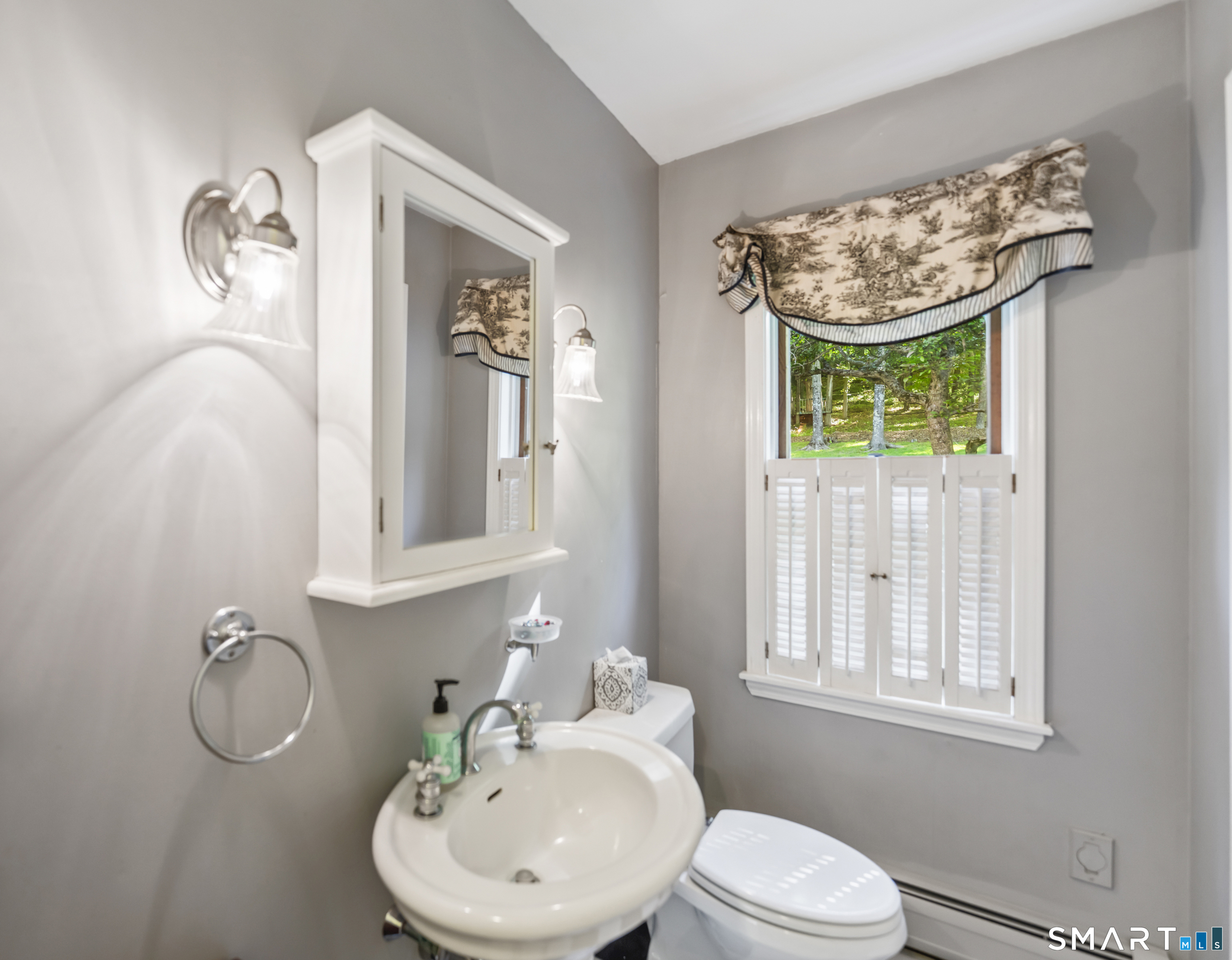18 Gelding Hill Road Newtown, CT 06482 - Photo 20 of 40 a bathroom with a toilet sink and mirror