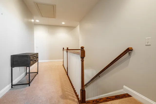 a bathroom with a granite countertop sink a mirror and a bathtub