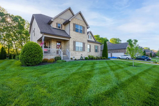 a front view of a house with garden