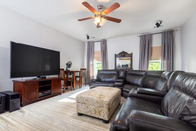 a building outdoor space with patio furniture and potted plants