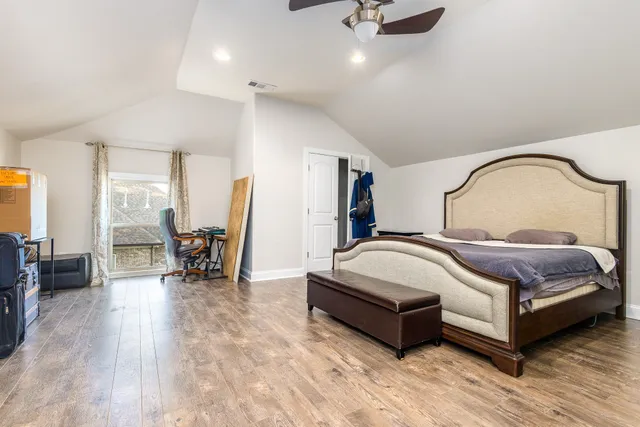 a view of a patio with a table chairs and a table