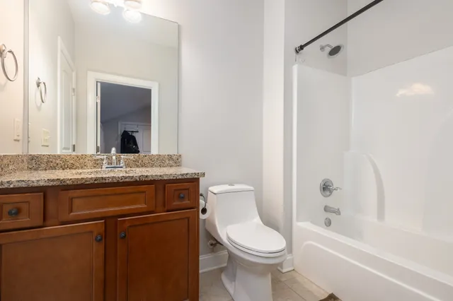 a view of a house with swimming pool and sitting area