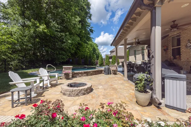 a view of a house with a yard porch and sitting area