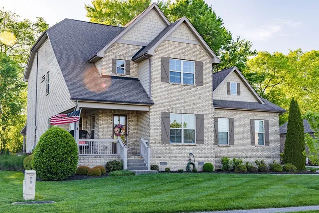 a aerial view of a house with a yard