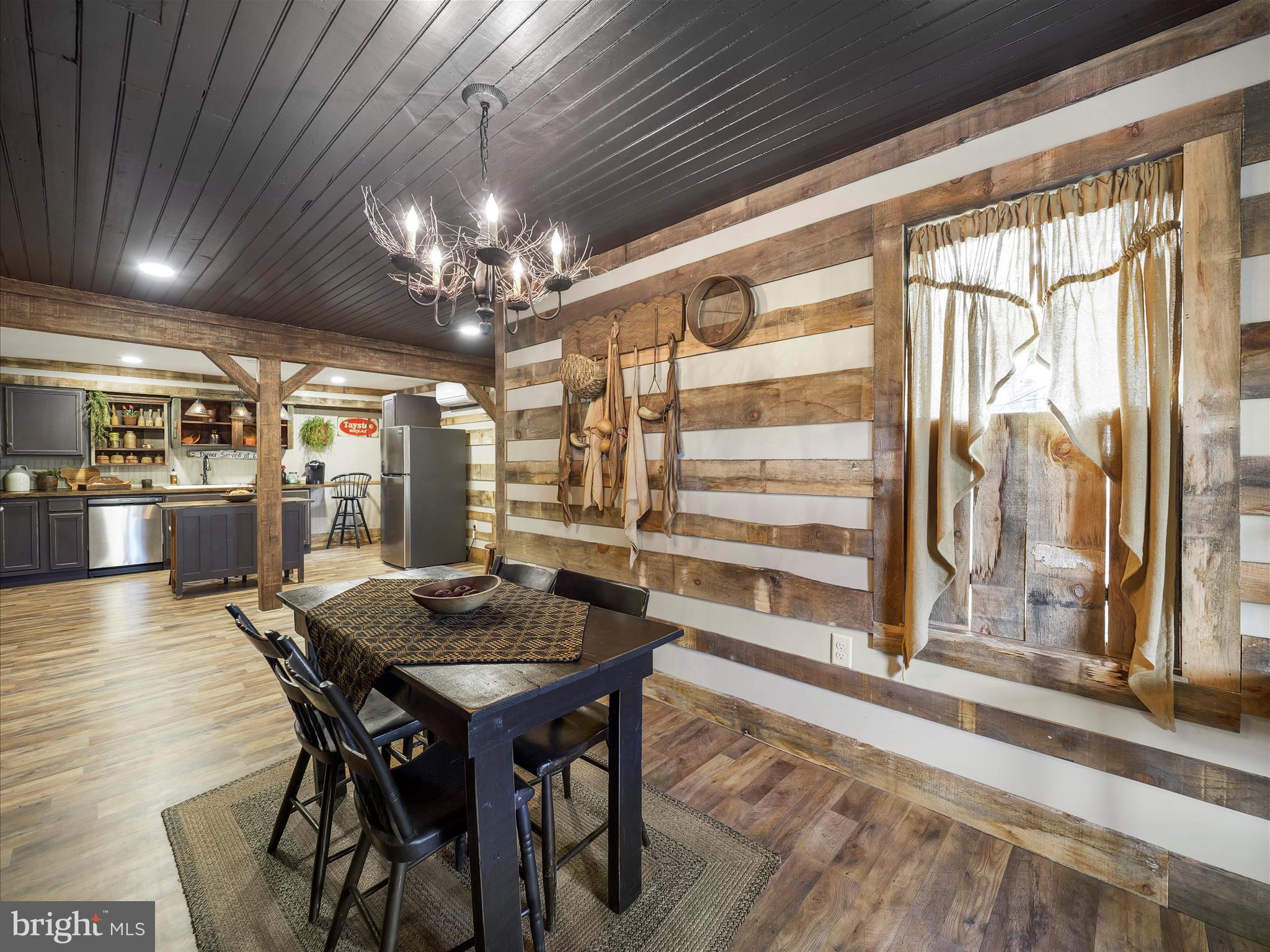 19031 Back Road Dry Run, PA 17220 - Photo 11 of 46 a view of a dining room with furniture window and wooden floor