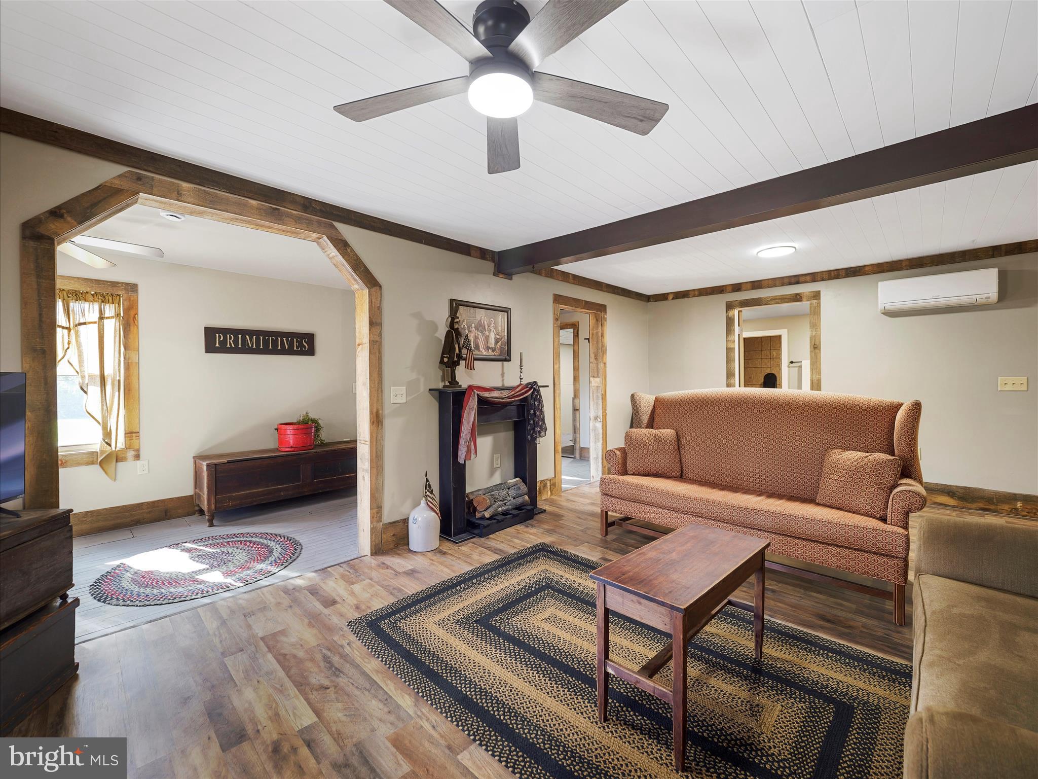 19031 Back Road Dry Run, PA 17220 - Photo 13 of 46 a living room with furniture and a fireplace