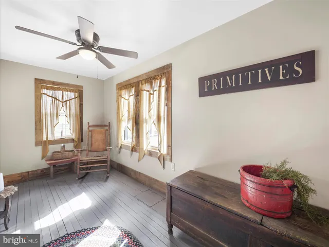a hallway with a couch and chandelier