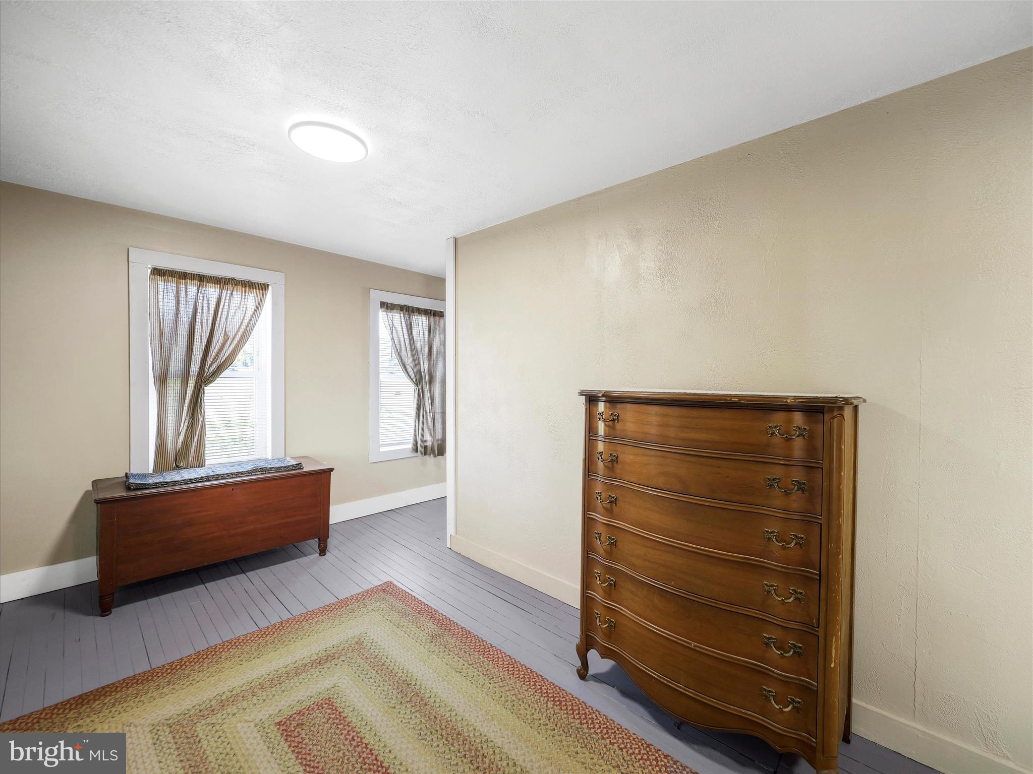 19031 Back Road Dry Run, PA 17220 - Photo 27 of 46 a view of room with window and wooden floor