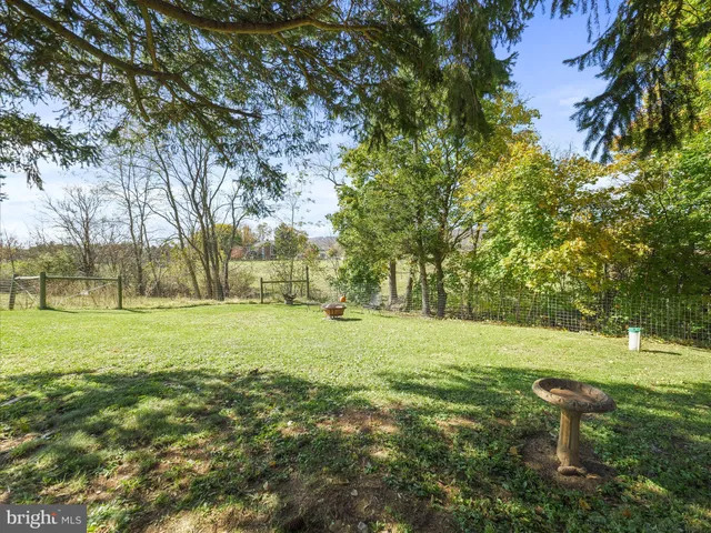 a view of outdoor space with deck and yard