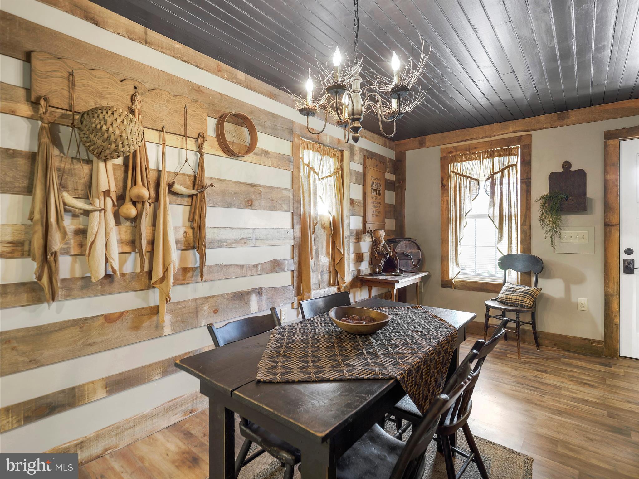 19031 Back Road Dry Run, PA 17220 - Photo 10 of 46 a view of a dining room with furniture wooden floor and chandelier