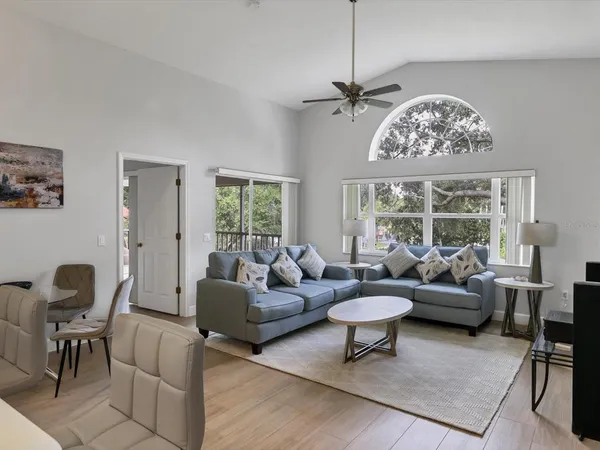 a living room with furniture and a large window