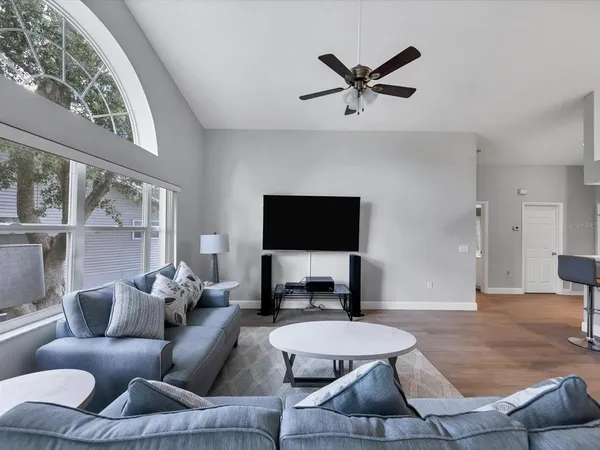 a living room with furniture and a flat screen tv