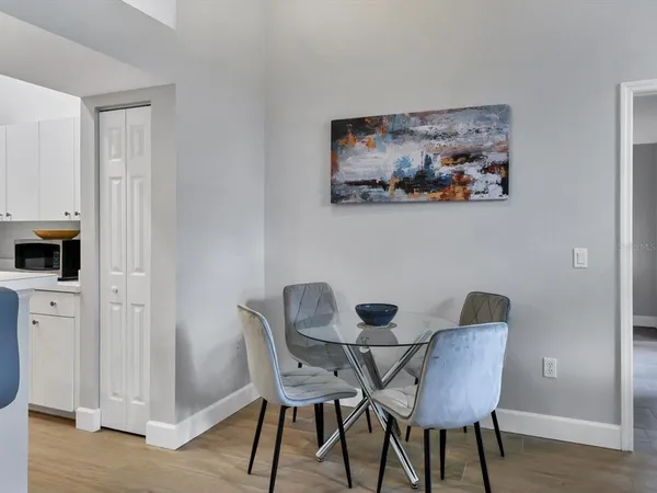 a view of a dining room with furniture and wooden floor