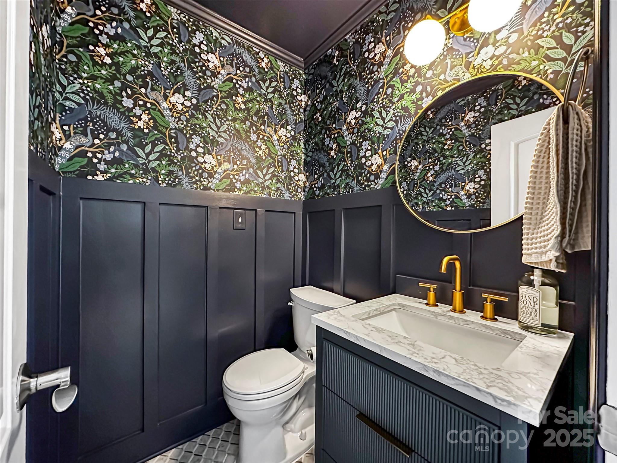 9501 Bartlett Road Mint Hill, NC 28227 - Photo 18 of 48 a bathroom with a granite countertop sink and a toilet