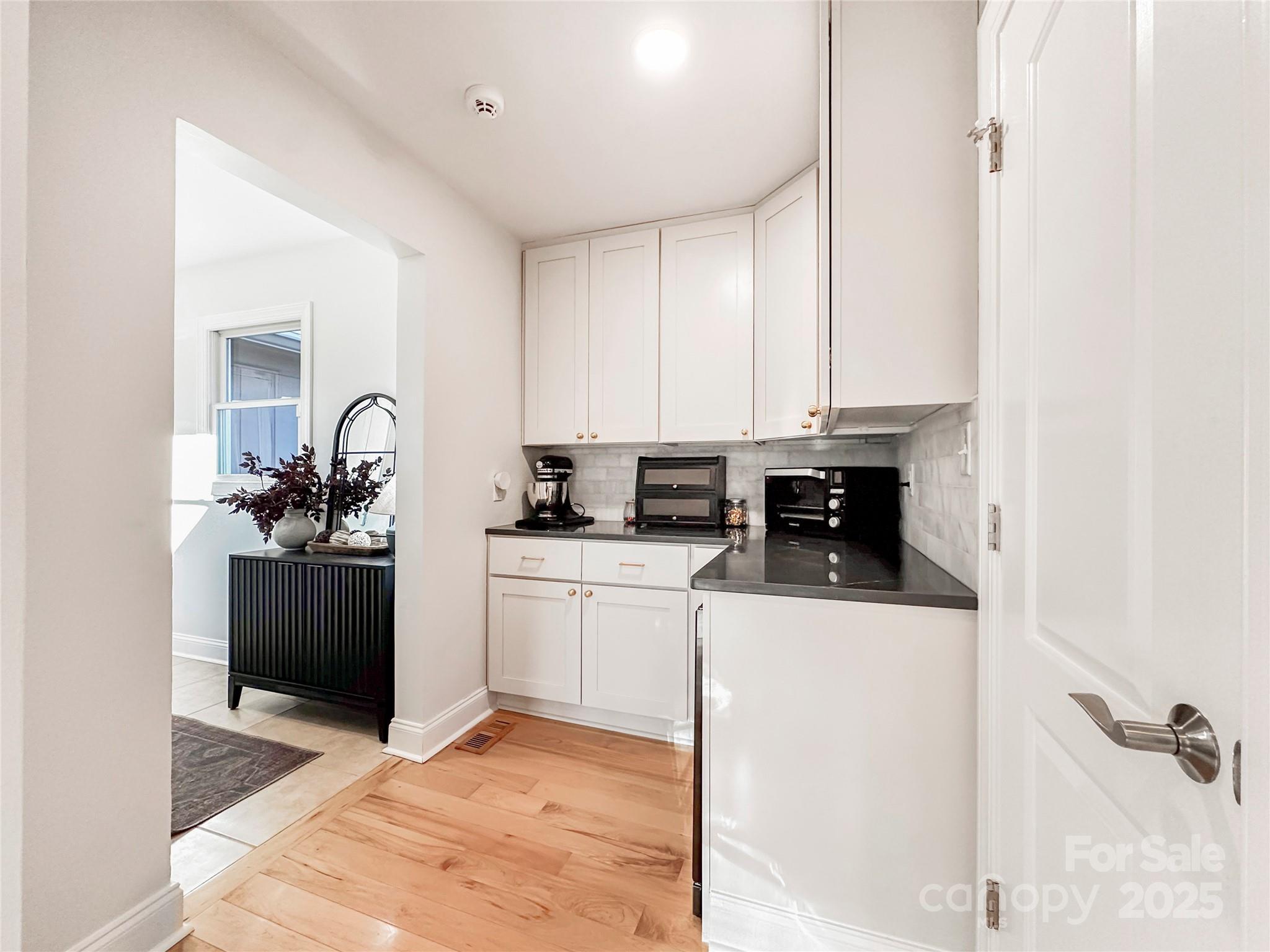 9501 Bartlett Road Mint Hill, NC 28227 - Photo 27 of 48 a kitchen with a sink and cabinets