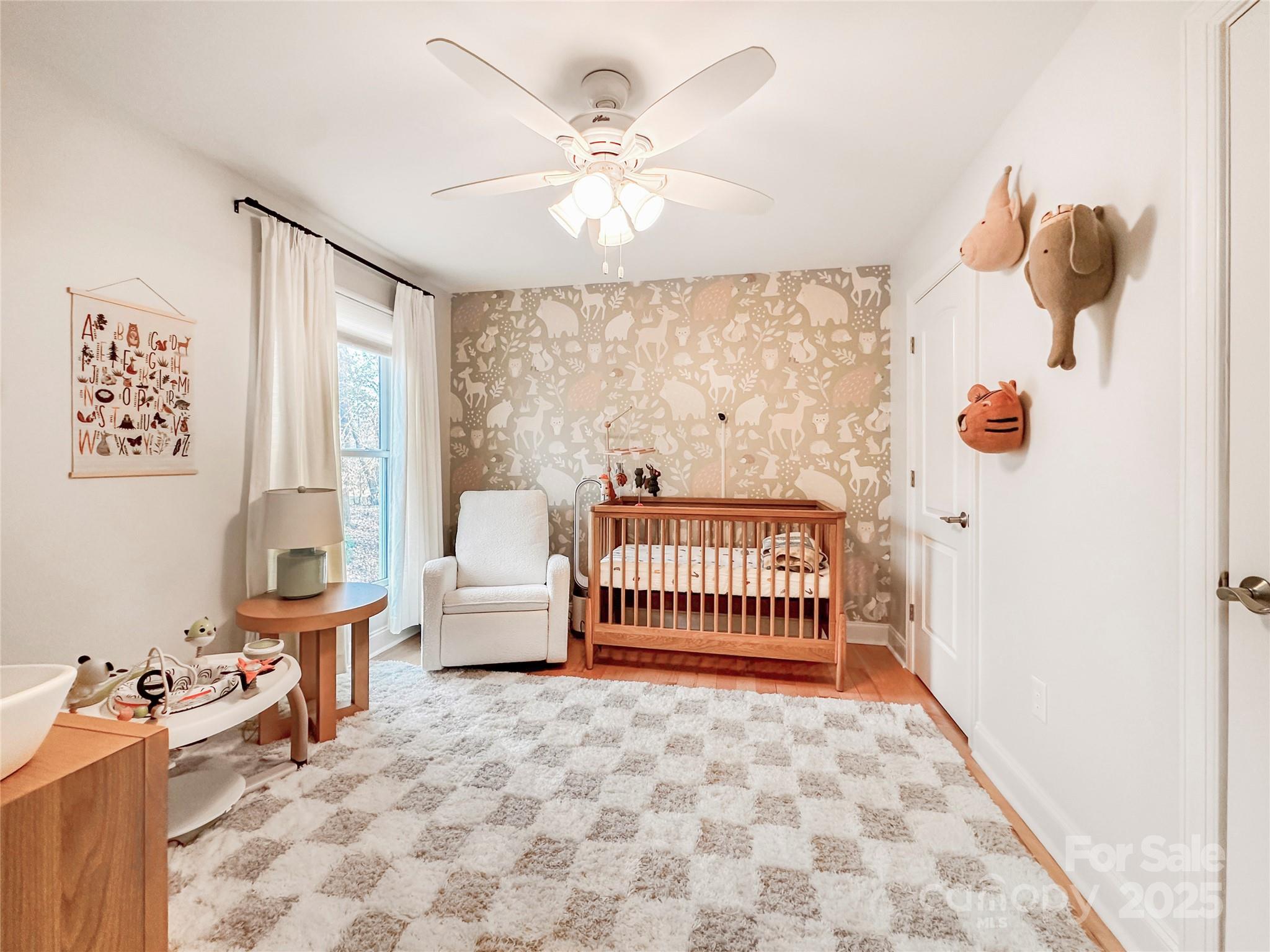 9501 Bartlett Road Mint Hill, NC 28227 - Photo 34 of 48 a bedroom with furniture and a window