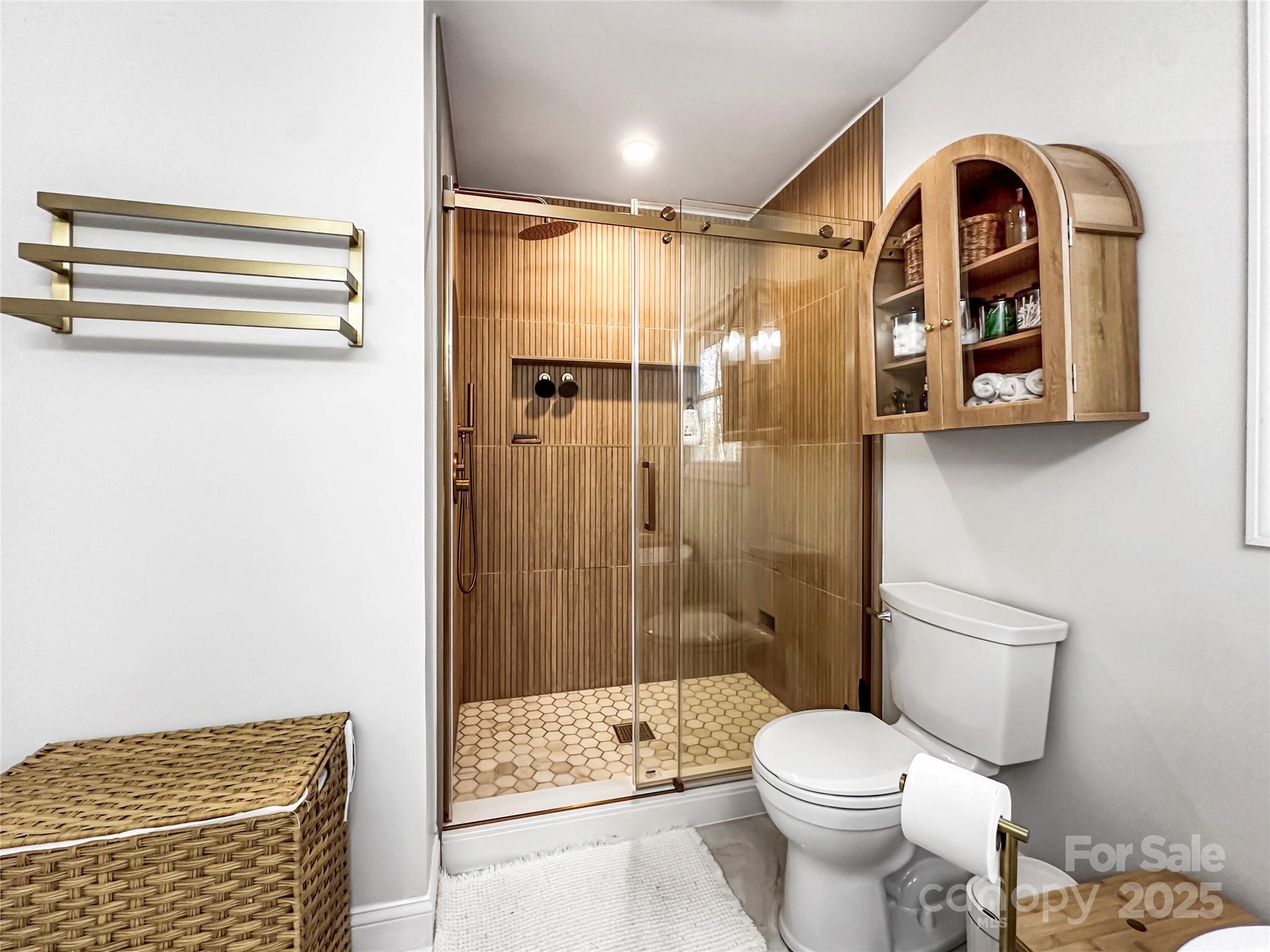 9501 Bartlett Road Mint Hill, NC 28227 - Photo 36 of 48 a bathroom with a toilet and a shower