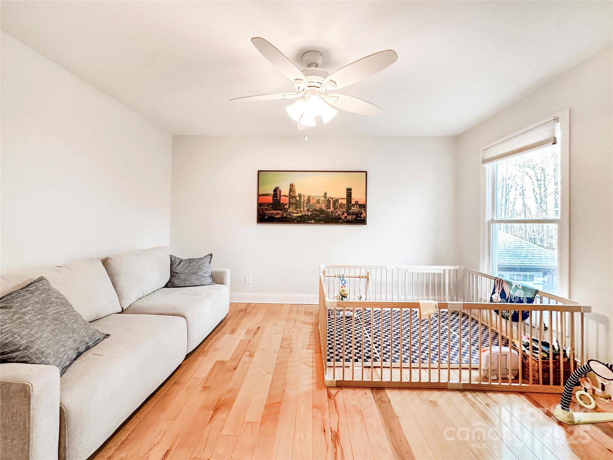 9501 Bartlett Road Mint Hill, NC 28227 - Photo 38 of 48 a bedroom with a large bed and a couch