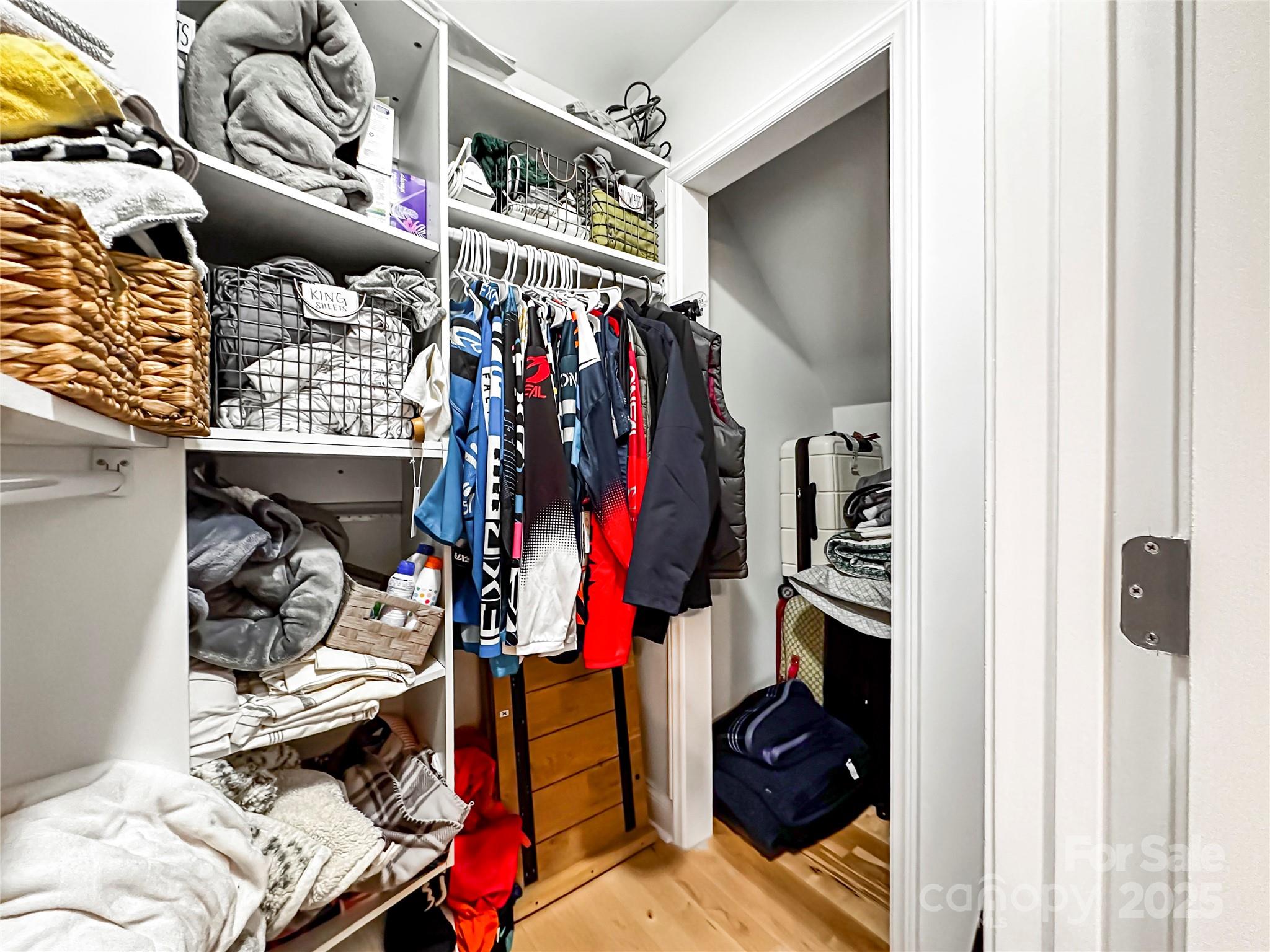 9501 Bartlett Road Mint Hill, NC 28227 - Photo 41 of 48 a view of walk in closet with clothes and shoes