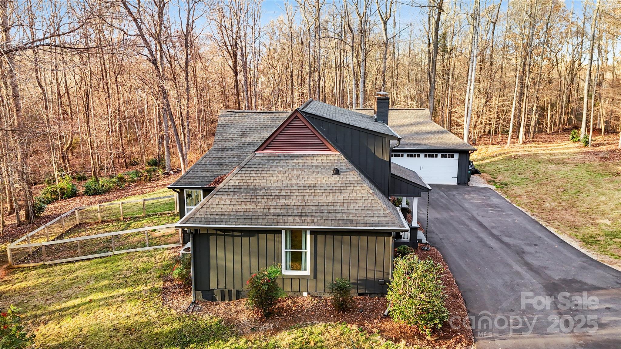 9501 Bartlett Road Mint Hill, NC 28227 - Photo 9 of 48 a house with trees in front of it