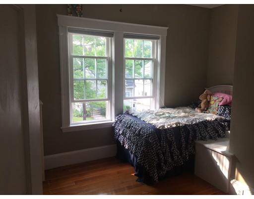 36 Overlook Road Arlington, MA 02474 - Photo 11 of 26 a bed sitting in a bedroom next to a window