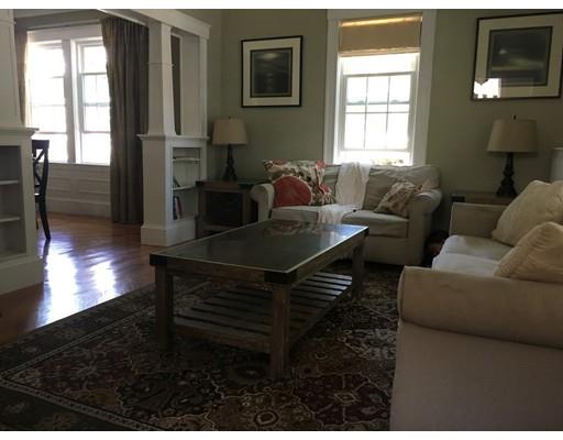 36 Overlook Road Arlington, MA 02474 - Photo 12 of 26 a living room with furniture a lamp and a window